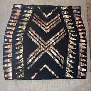 Express mini skirt black with gold.